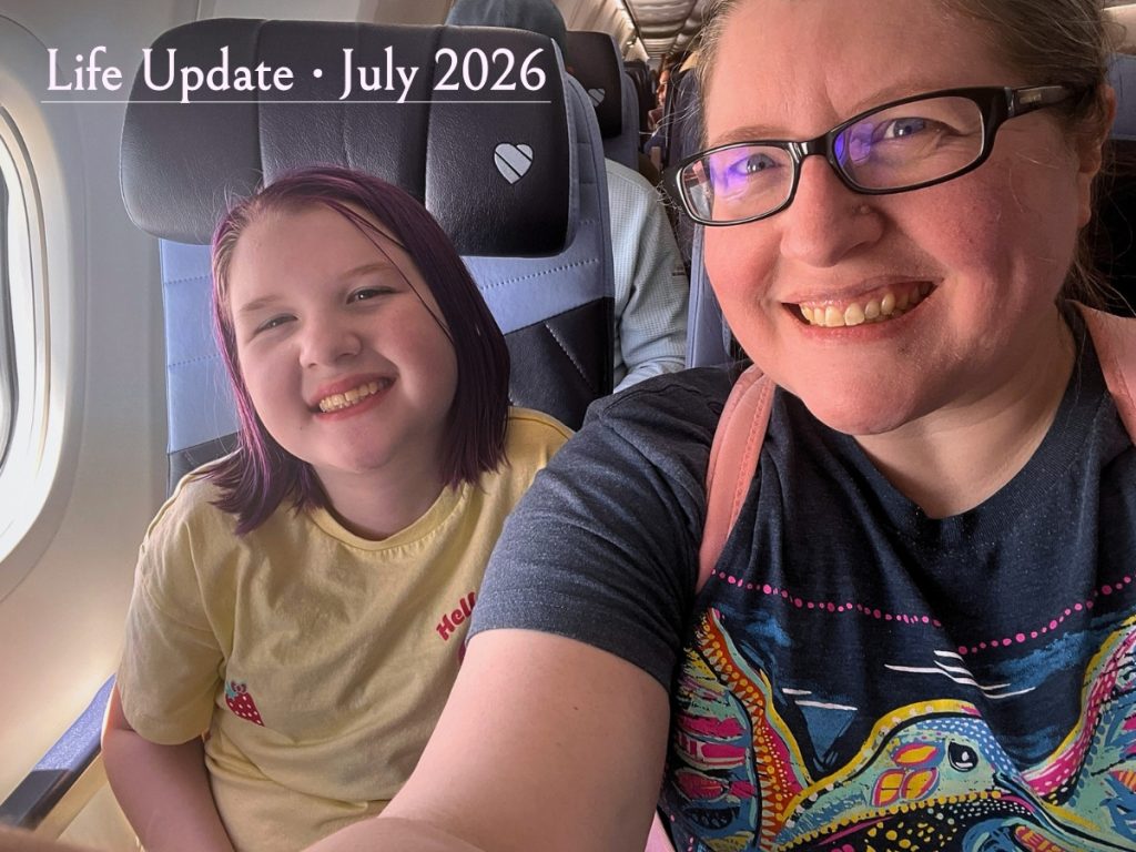 Mother and daughter smiling together on an airplane while traveling to meet Living One Day Today's first marketing client.
